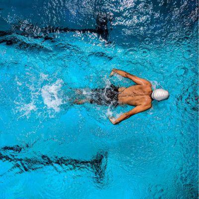 man swimming in a pool